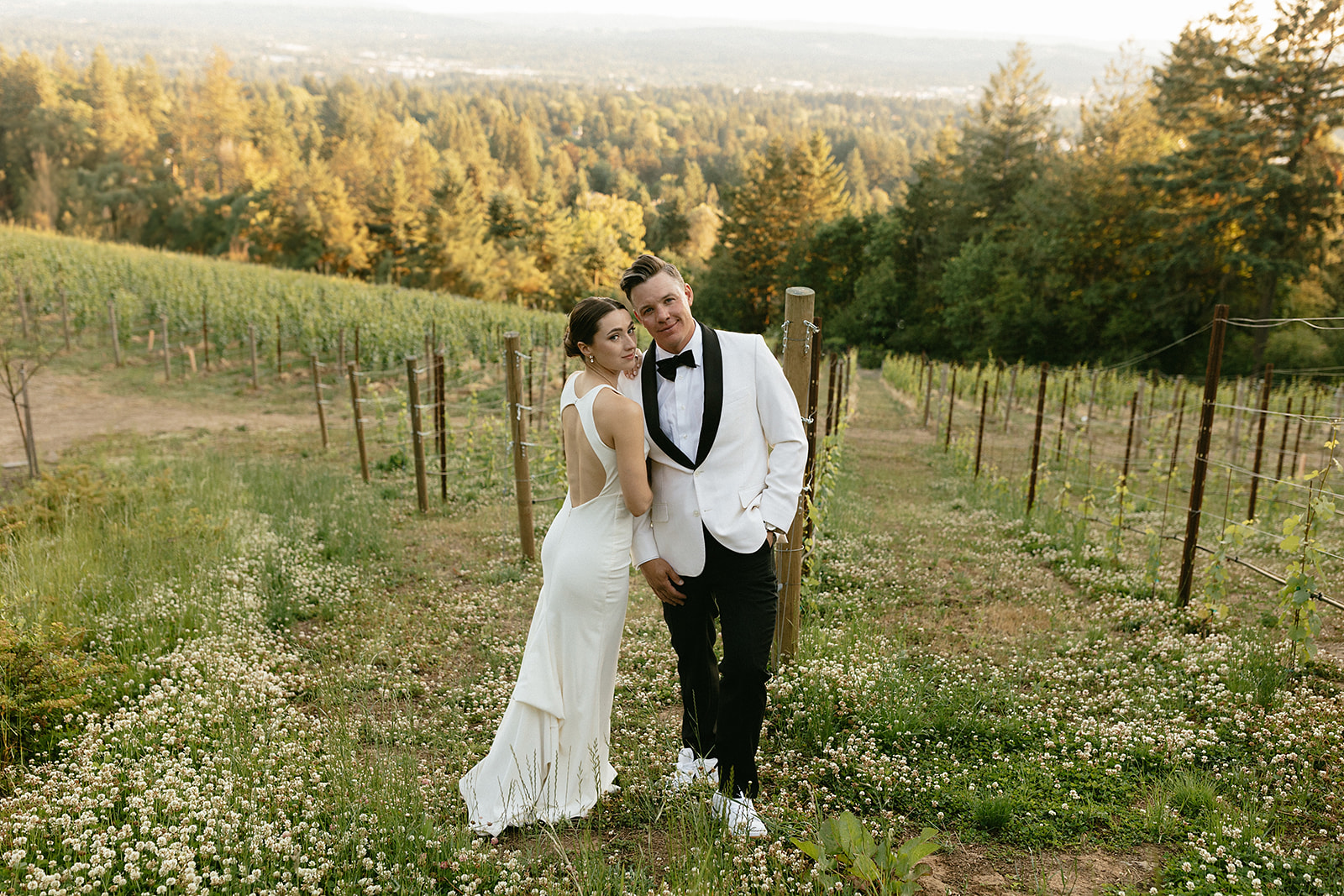 golden hour photos of the bride and groom in the vineyards at amaterra winery