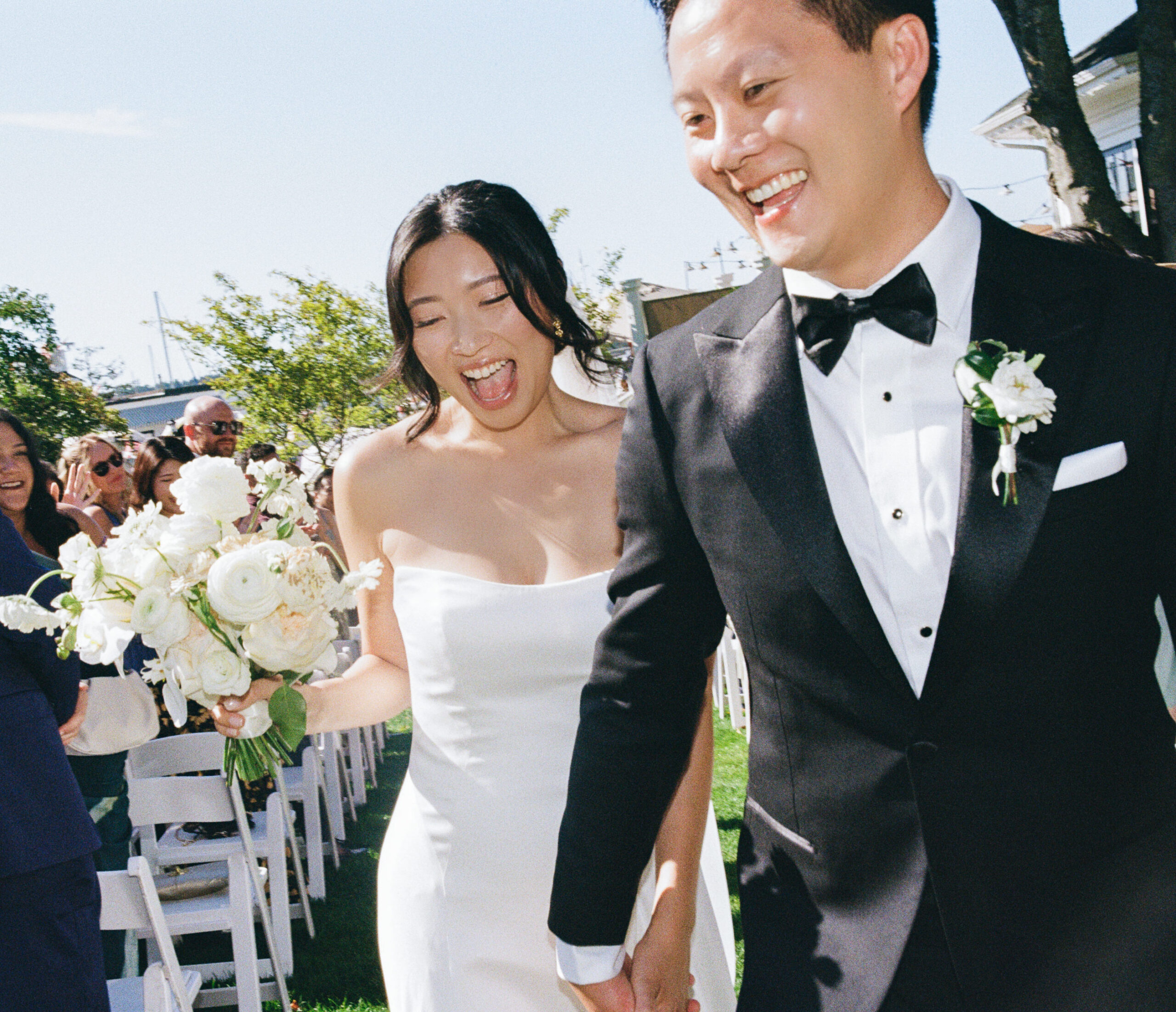Bride and groom celebrating their marriage after their wedding ceremony in Roche Harbor Resort